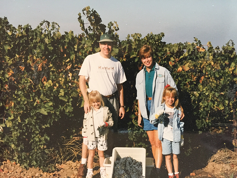 A photo of the Kent family in 1996, standing in the vineyards